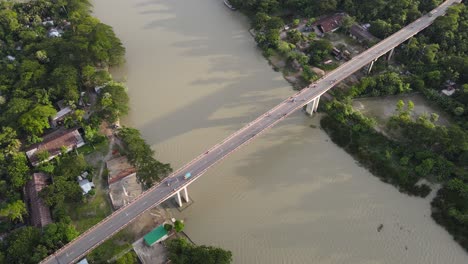 aerial view of bridge connecting riverbank villages from two district in bangladesh