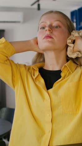 woman adjusting her hair with a headband