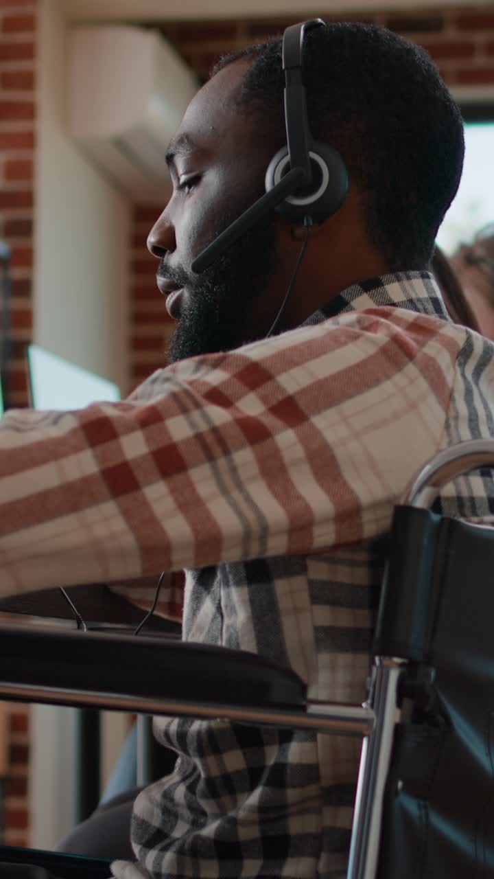 Call center team with a man in a wheelchair