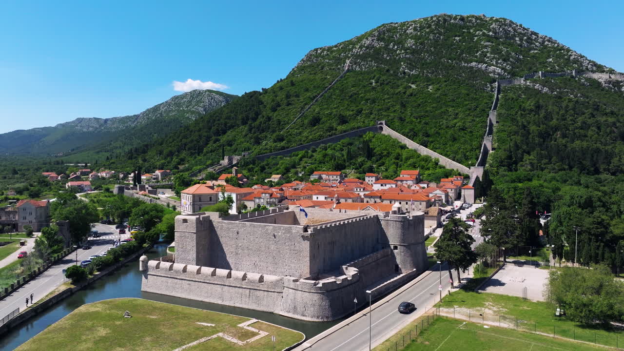 Kastio Fort With Defensive walls On The Mountain In Ston, Croatia. - aerial shot