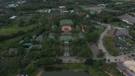 aerial shot of ancient buddhist temple and gardens in south vietnam