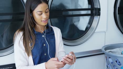 Woman-listening-music-on-mobile-phone-4k