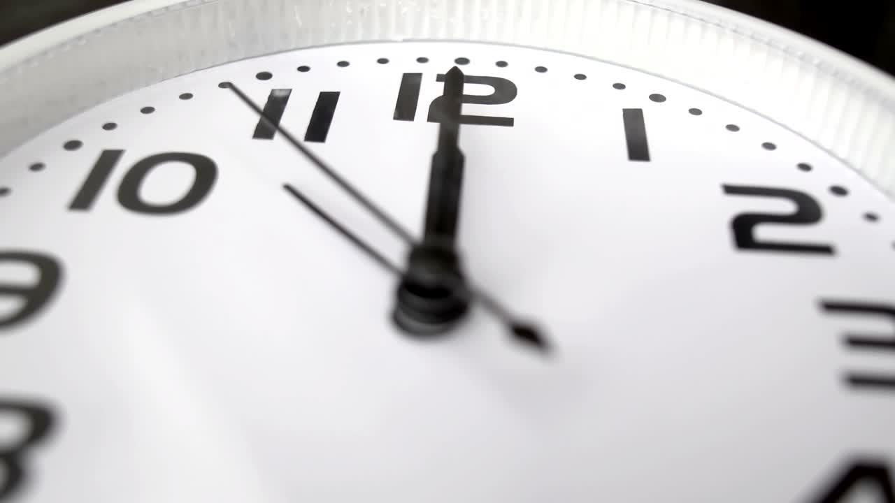 modern alarm clock is showing midday or midnight movement. It is twelve o'clock, holiday happy new year festive and christmas or lunch concept