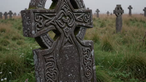 ancient celtic crosses in a grassy graveyard