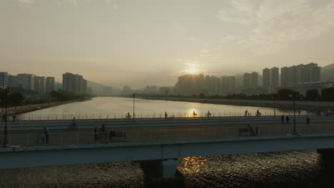 hong kong pedestrian walking over a bridge during stunning sunset aerial view of chinese city