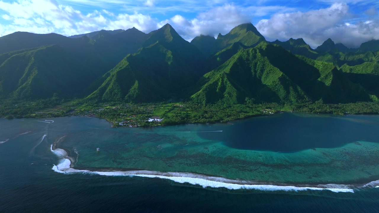 Tahiti harbor view landscape Teahupo'o surf waves sunny blue sky South Pacific Ocean aerial drone French Polynesia judge tower tour boats jet skis coral reef island Passe Havea volcano peaks forward