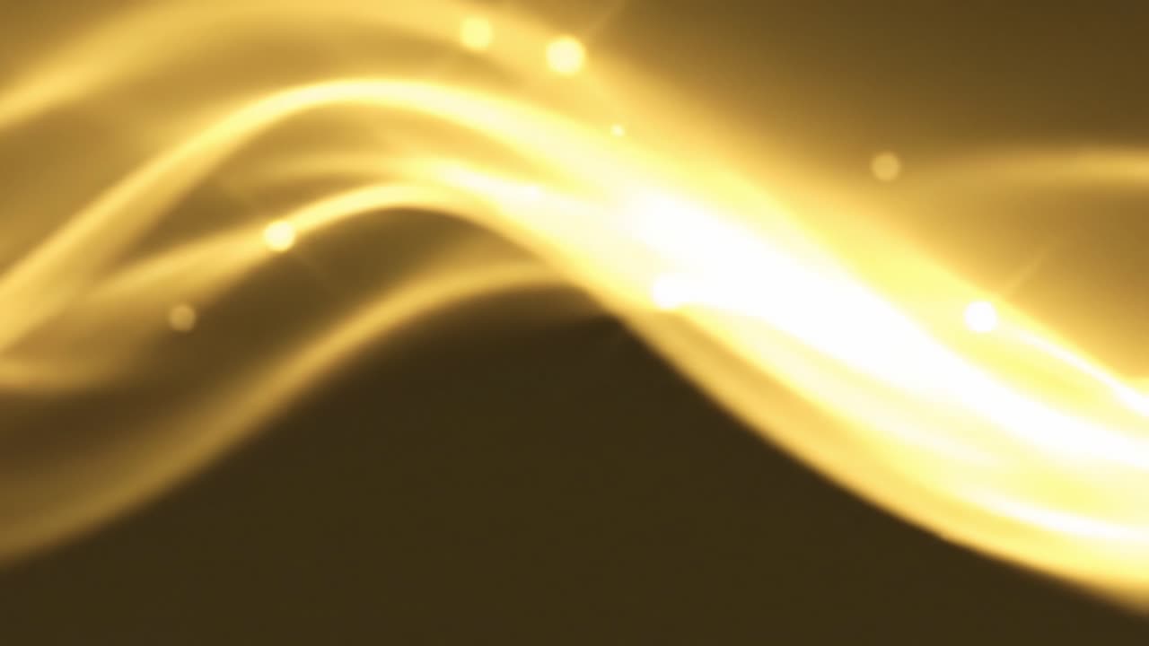 Soft, golden waves dance gracefully under dim lighting, creating a mesmerizing atmosphere. The ambient light enhances the fluid motions, inviting calm feelings.