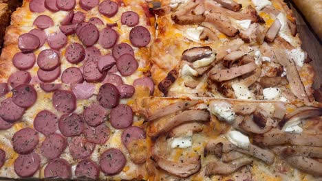 sliced pizza with various toppings on a wooden board