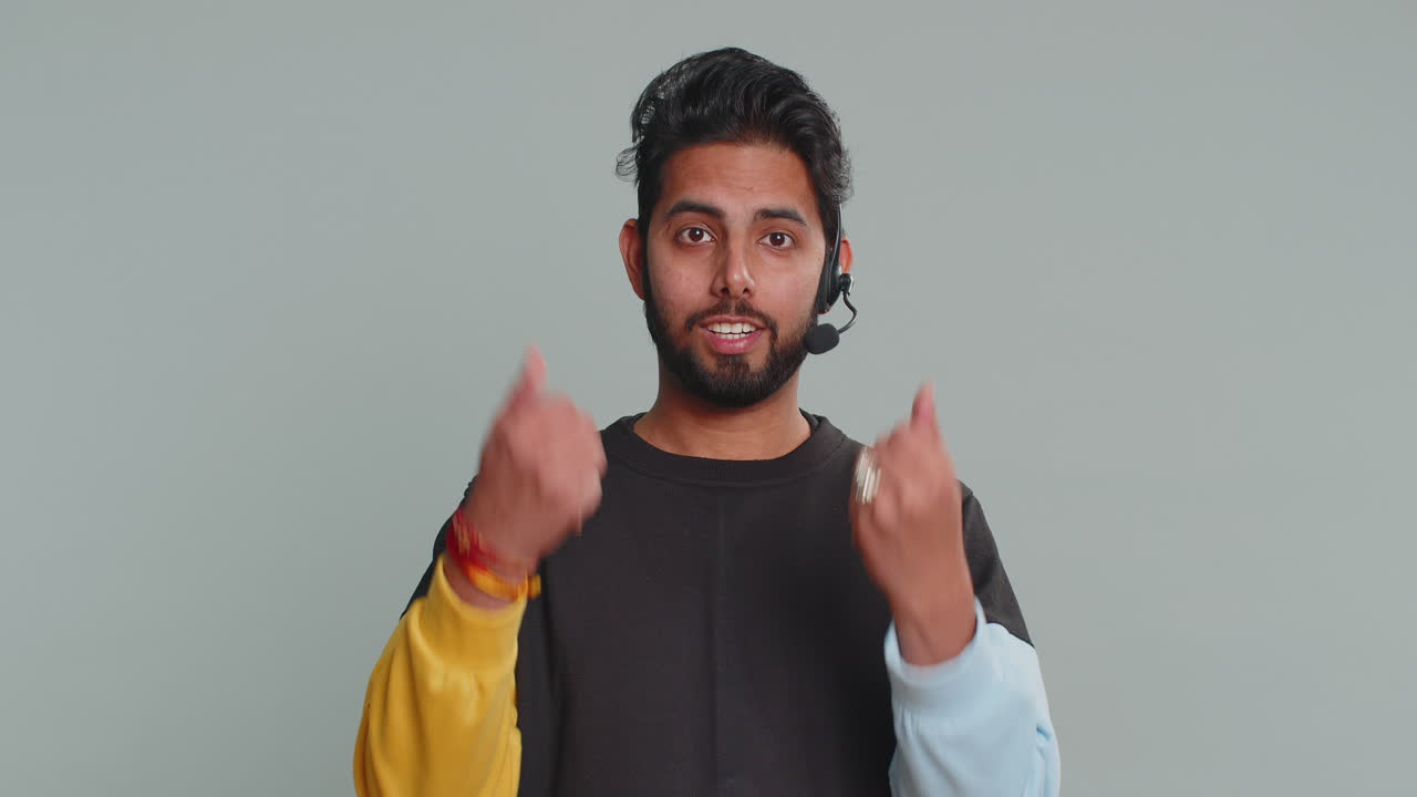 Man wearing headset freelance worker call center support service operator helpline communication