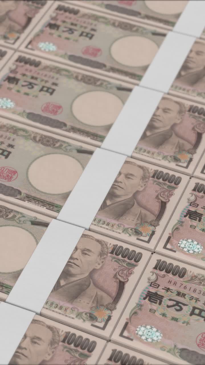 Lodret video af 10000 JAPANSKE YEN pengesedler der trykkes af en pengemaskine