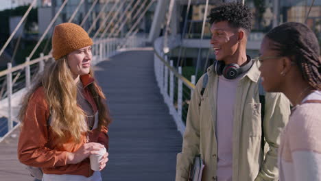 students chatting on campus bridge