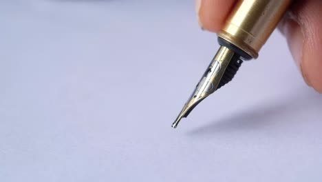 hand writing with a fountain pen