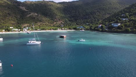 stunning view of a harbor full of beautiful large sailing boats in the british virgin islands