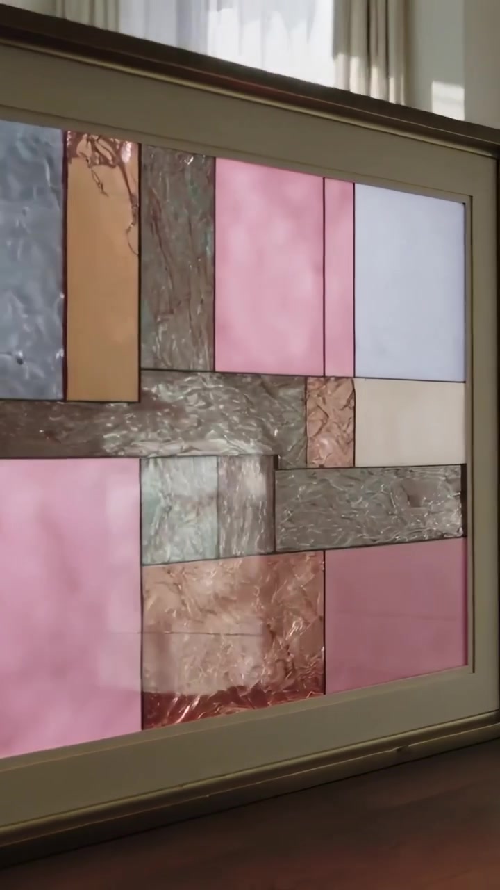 Vertical video: Moving sunlight, camera panning framed panel on wall at home, capturing reflections