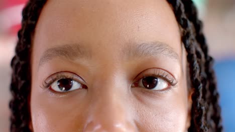 Portrait-of-happy-eyes-of-african-american-casual-businesswoman-in-office