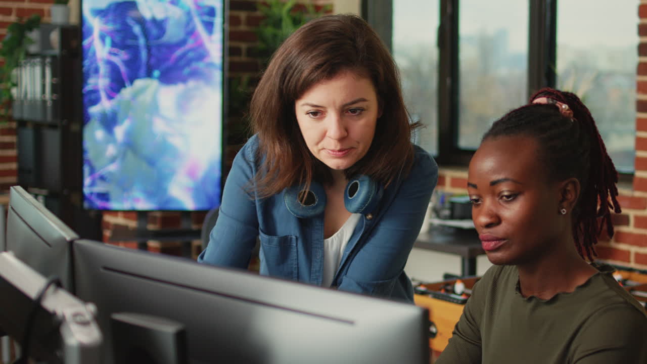 People doing teamwork to develop new interface in agency office