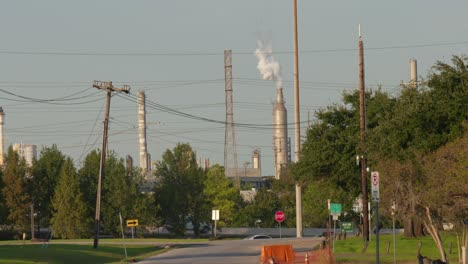 establishing shot of chemical refinery plant in pasadena, texas community