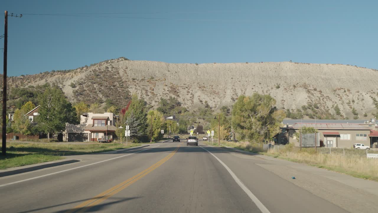 Scenic Road with Mountain View and Houses