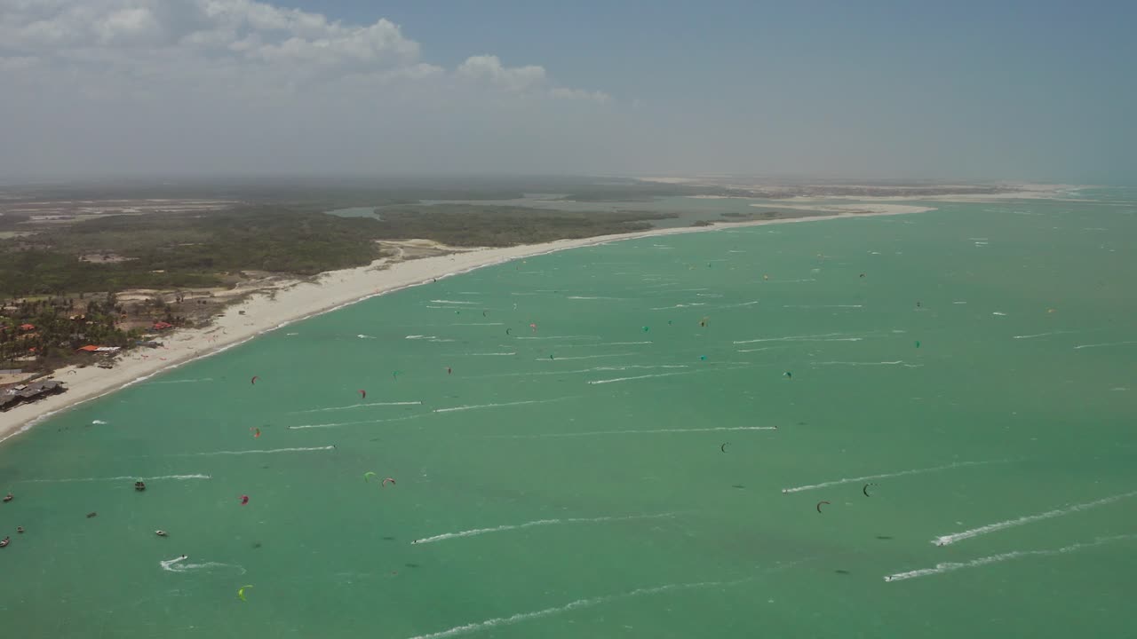 Aerial view of kitesurfing on a tropical beach