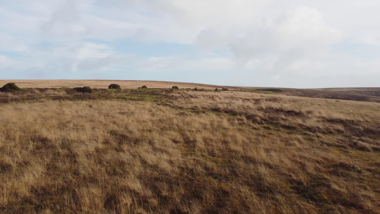 Pushing Aerial View Over Moorland Revealing Countryside Road in Exmoor UK 4K
