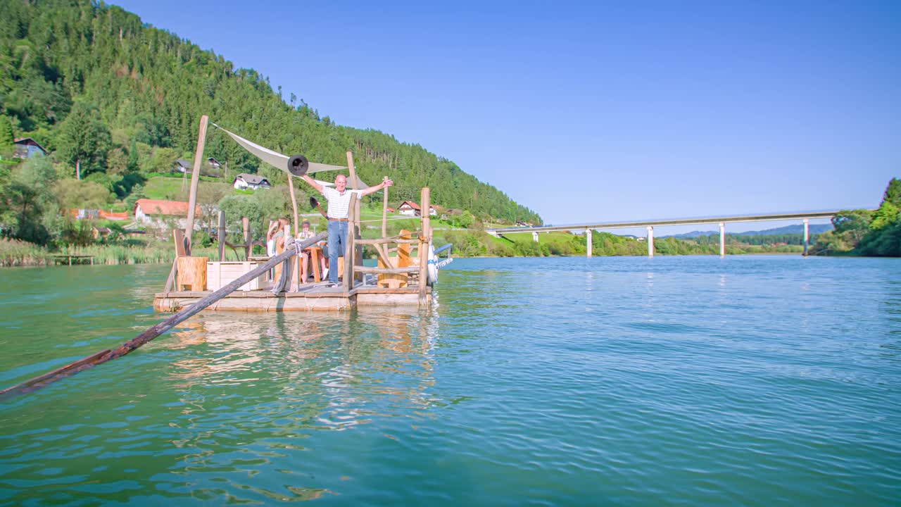 happy and joyful men waving from raft. Traditional Koroska experience. Arc shot
