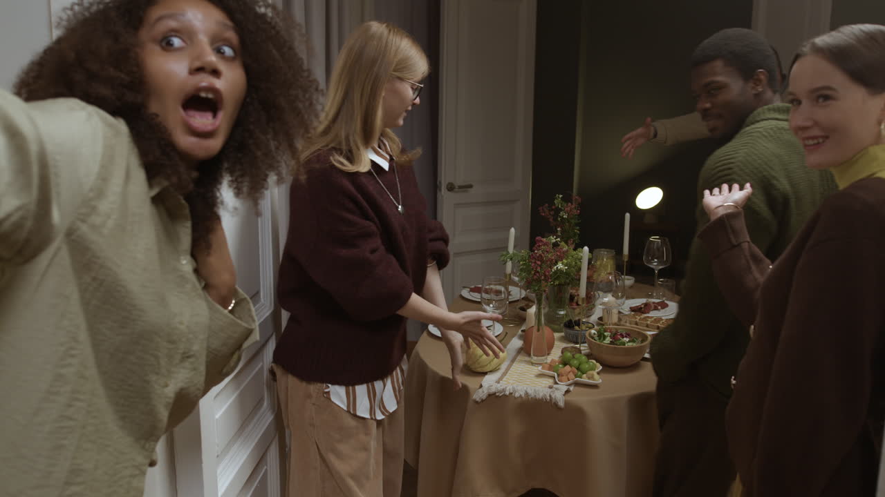People gathering around a dinner table