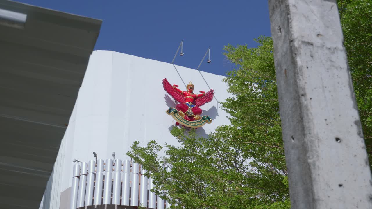 A stationary handheld shot of the Garuda or the national and royal symbol of Thailand