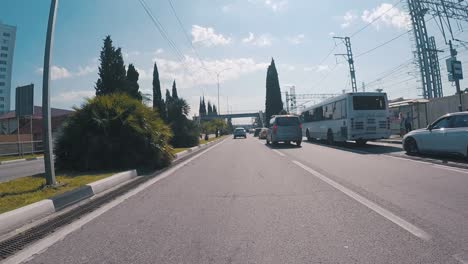 city street with cars and overpass