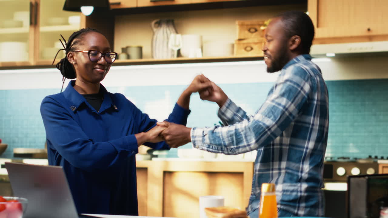 Couple enjoying time in kitchen