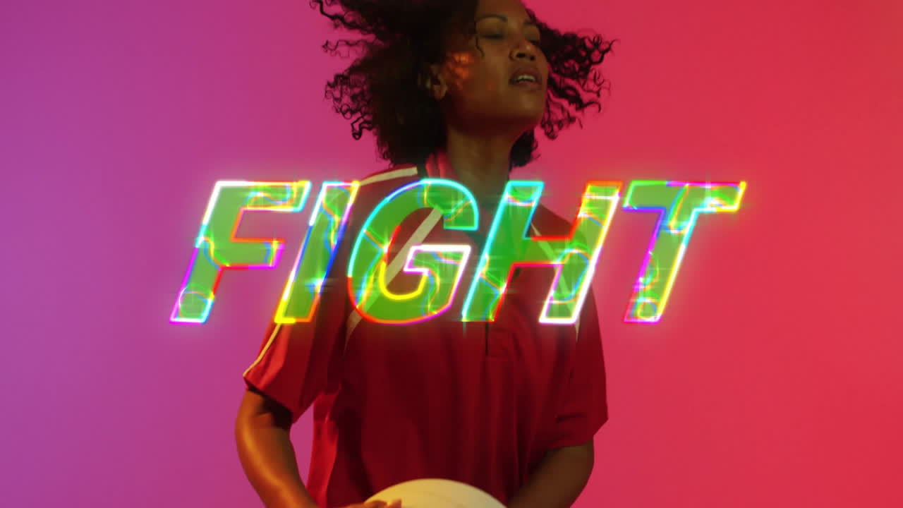 Person holding volleyball with FIGHT text animation over colorful background