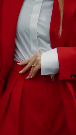 woman in red suit and white shirt