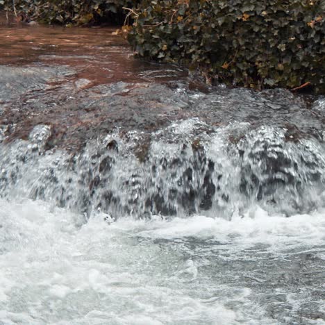 white mountain stream water falling down