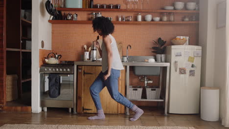 happy-woman-dancing-in-kitchen-celebrating-successful-lifestyle-enjoying-cheerful-victory-dance-celebration