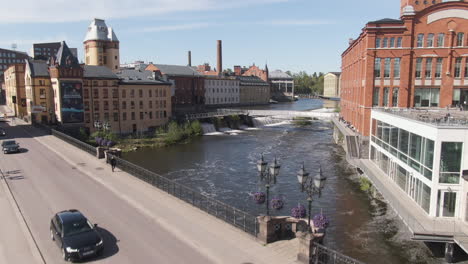 majestic bridge and river in city of norrkoping with beautiful old town buildings