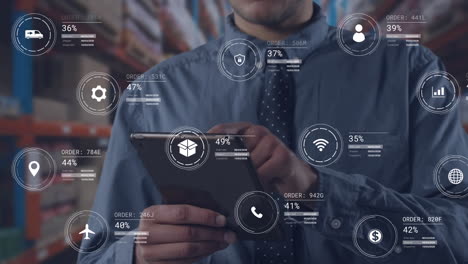 animation of icons with data processing over caucasian worker using tablet in warehouse