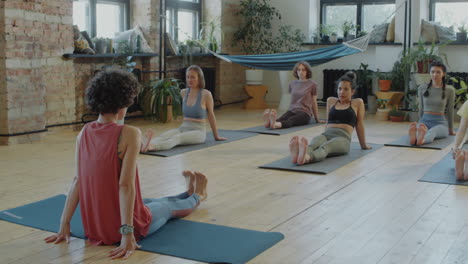 women practicing asana on yoga class