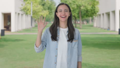 happy indian girl saying hello