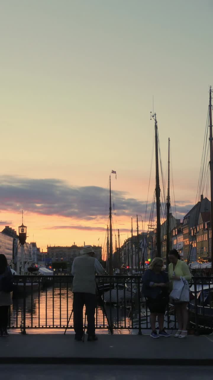 Time Lapse of People and Boats at Nyhavn Canal in Copenhagen at Sunset