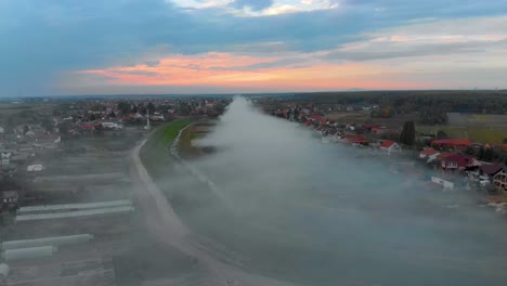 flying in smoke cloud with beautiful sunset on horizon