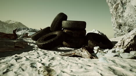 old-tires-overgrown-embedded-in-the-sand