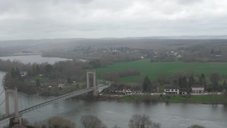 High-angle-overlooking-suspension-bridge-at-Les-Andelys-on-overcast-day