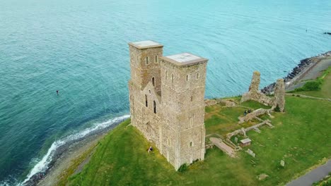 a beautiful drone aerial over the reculver towers an abandoned abbey in kent england 1