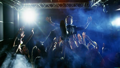 crowd surfing at a concert 4k