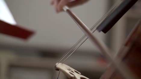 Close-Up-of-Bow-on-Cello-Strings