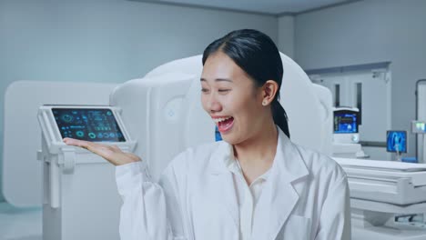 close up of asian woman doctor smiling and pointing to the side with mri machine in the hospital