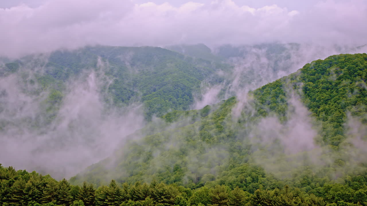 Mist-covered Smoky Mountains seen from a cinematic drone perspective