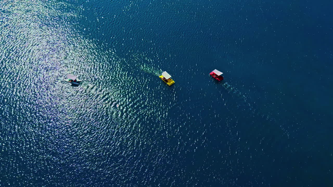 Tourists paddling pedal boats on Lake Kournas