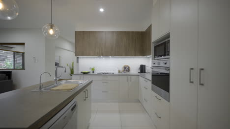 contemporary open plan kitchen, island bench and breakfast area