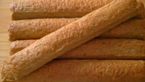 fried chinese fish cake or fish ball line on wood board