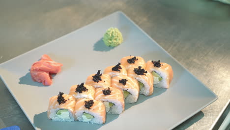 sushi philadelphia. professional chef prepares rolls for the client in a commercial kitchen.